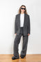 The Tailored Jacket by Coperni is a double breasted jacket with a relaxed fit in a seasonal windowpane check