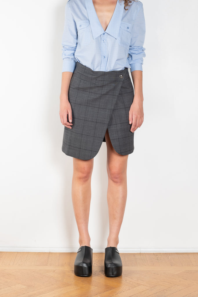 The Wraparound Skirt by Coperni is mid length wrap skirt with front slit