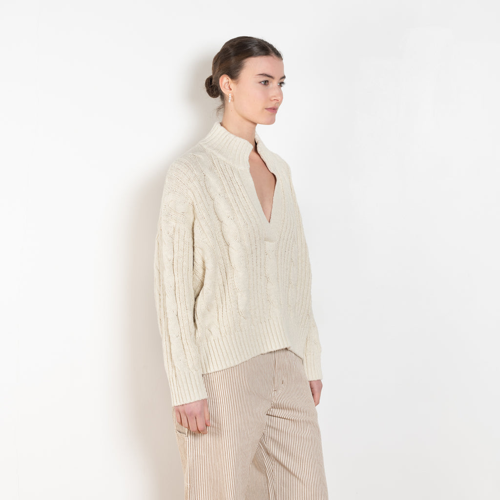 The Split Neck Cable Sweater By Denimist is a relaxed cable knit sweater in a soft cotton