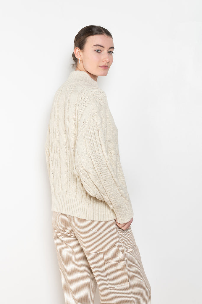 The Split Neck Cable Sweater By Denimist is a relaxed cable knit sweater in a soft cotton