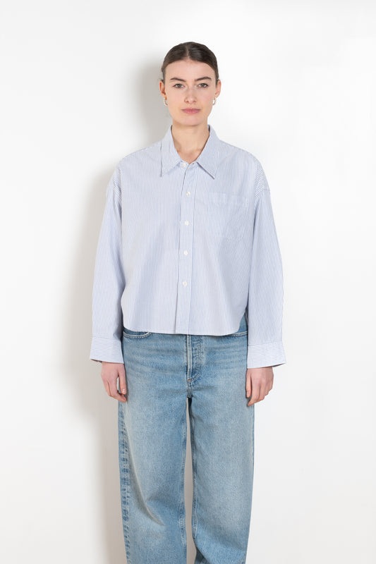 The Cropped Shirt By Denimist is a boxy loose cotton button up shirt with a blue stripe