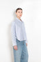 The Cropped Shirt By Denimist is a boxy loose cotton button up shirt with a blue stripe