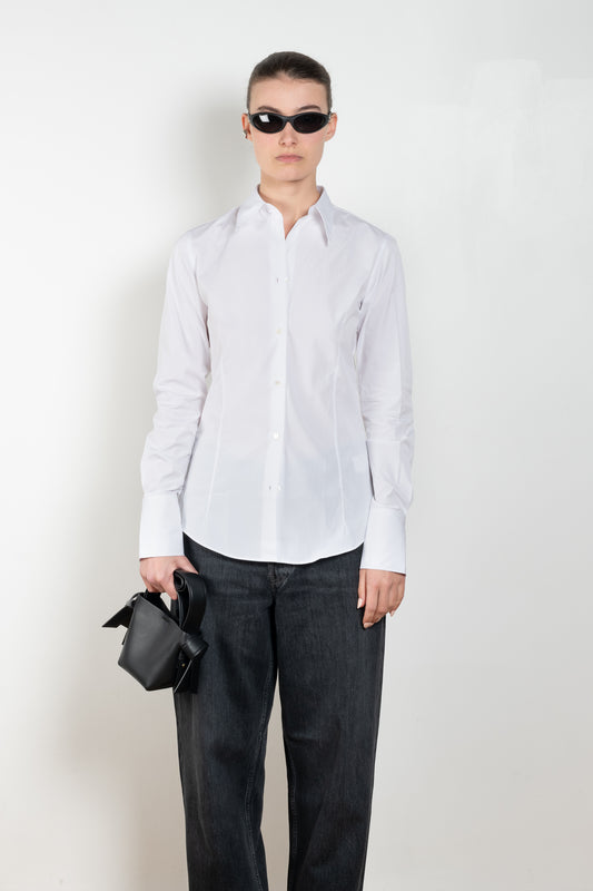 The Giulia Shirt by Flore Flore is a slim fitted shirt with a pointy collar and lengthened single buttoned cuffs with two pleats on the back