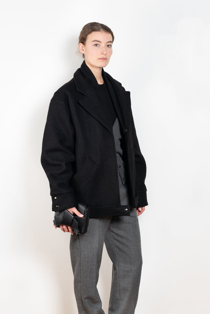 The Biker Jacket in mud by KASSL Editions is crafted from boiled wool