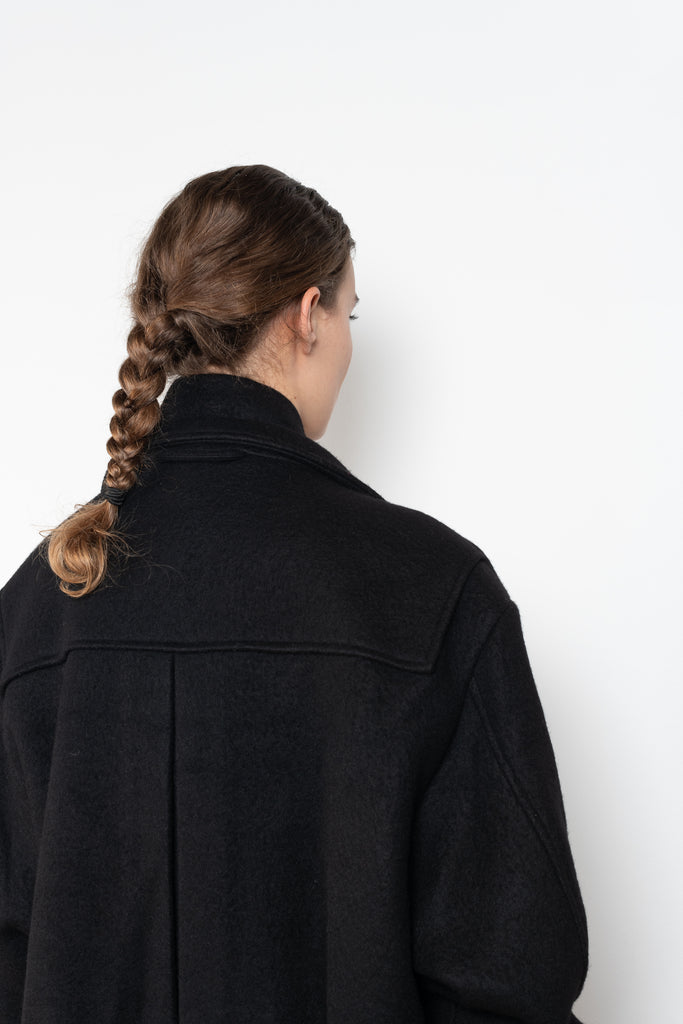 The Biker Jacket in mud by KASSL Editions is crafted from boiled wool