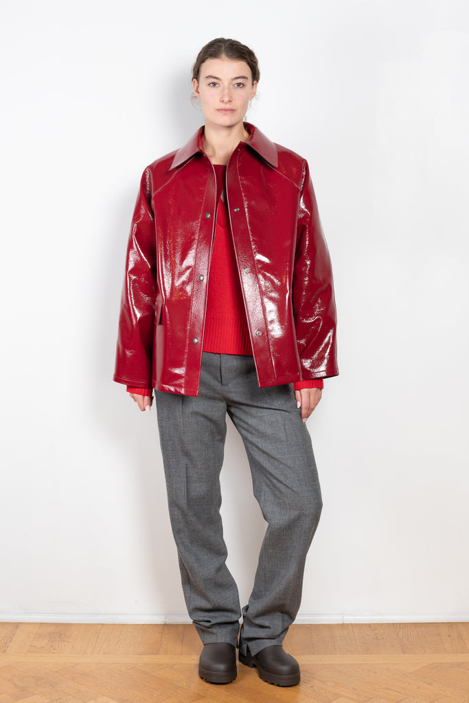 The Original Hip Lacquer Jacket by Kassl Editions is crafted from bold and striking red lacquer wool in a vibrant red color