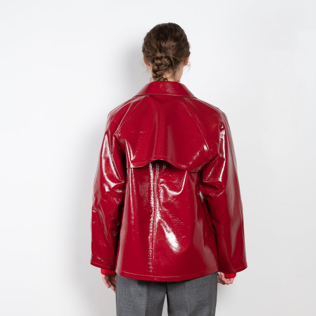 The Original Hip Lacquer Jacket by Kassl Editions is crafted from bold and striking red lacquer wool in a vibrant red color