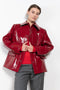 The Original Hip Lacquer Jacket by Kassl Editions is crafted from bold and striking red lacquer wool in a vibrant red color