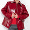 The Original Hip Lacquer Jacket by Kassl Editions is crafted from bold and striking red lacquer wool in a vibrant red color