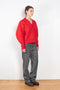 The V-Sweater by Kassl Edtions is crafted from boiled heavy merino wool in a vibrant red color.