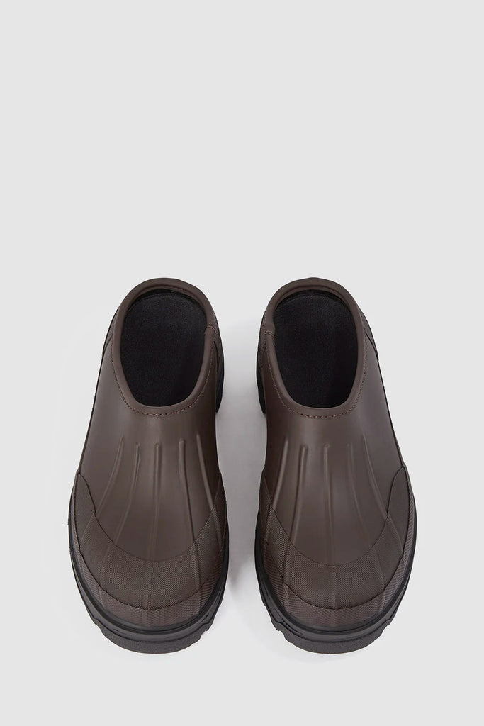 The Eefje Clog by Kassl Editions in coffee brown is a rubber slip-on clog crafted from TRETORN'S signature FSC-natural rubber