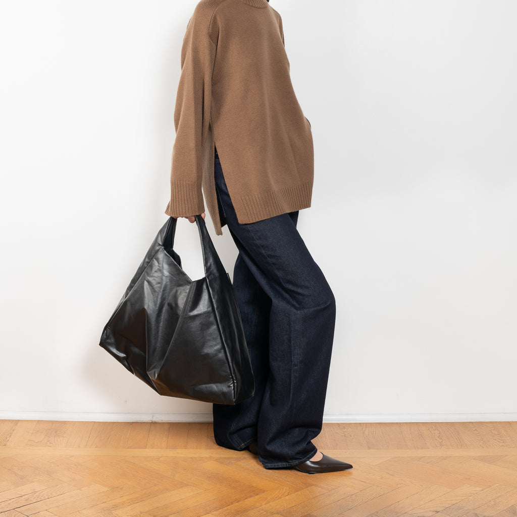 The Tote Shoulder Oil by Kassl Editions is crafted from the signature oil coated cotton-blend