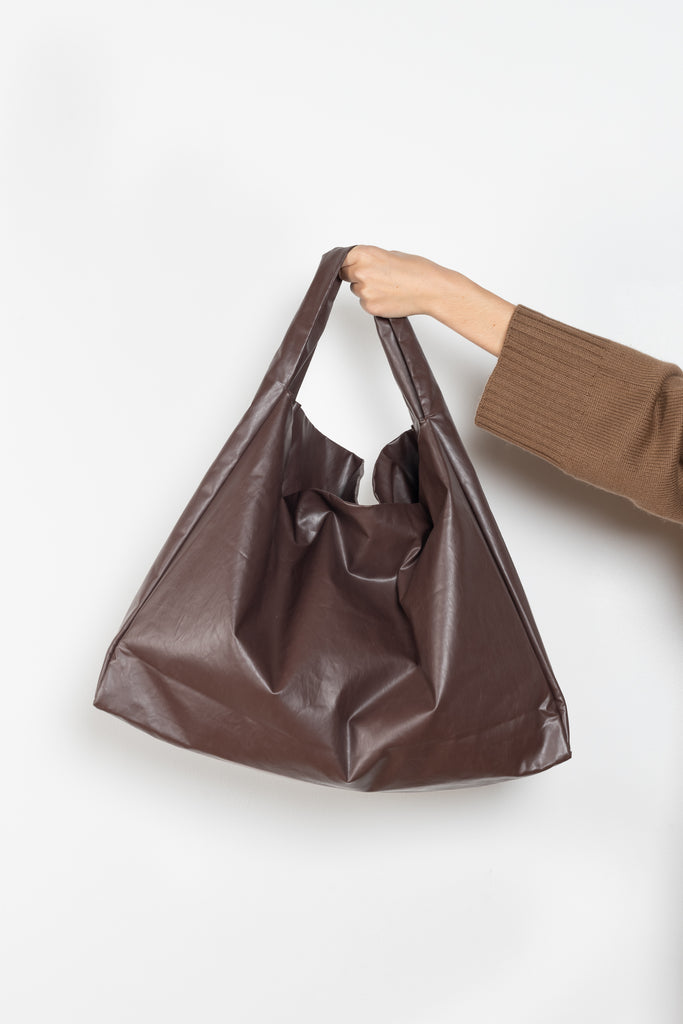 The Tote Shoulder Oil by Kassl Editions is crafted from the signature oil coated cotton-blend
