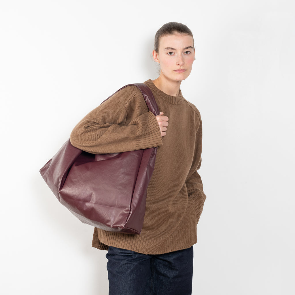 The Tote Shoulder Oil by Kassl Editions is crafted from the signature oil coated cotton-blend