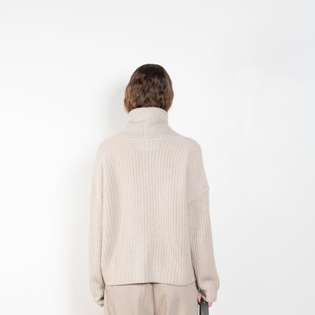 The Annalike Cardigan Jacket by Lisa Yang is a cardigan vest in a fisherman ribbed cashmere with a shawl-neck collar