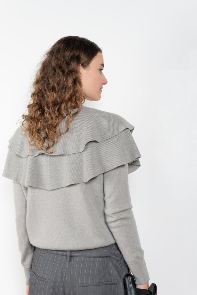 The Aubrey Sweater by Lisa Yang is a feminine cardigan top with a big ruffle detail collar