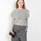 The Aubrey Sweater by Lisa Yang is a feminine cardigan top with a big ruffle detail collar
