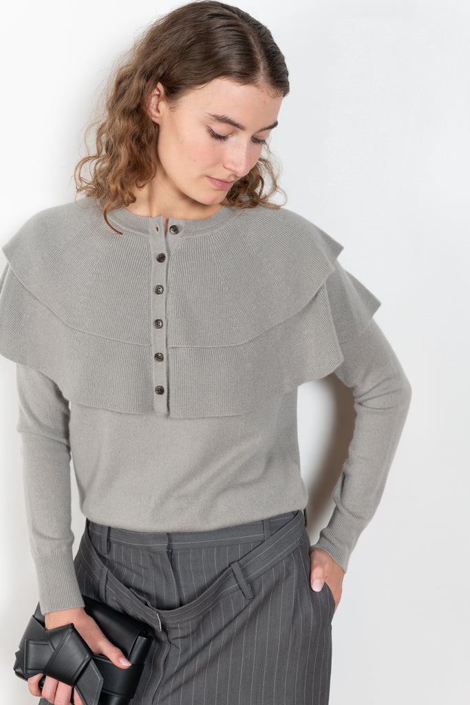 The Aubrey Sweater by Lisa Yang is a feminine cardigan top with a big ruffle detail collar