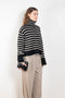 The Fleur Sweater by Lisa Yang has a relaxed silhouette with a loose high neck