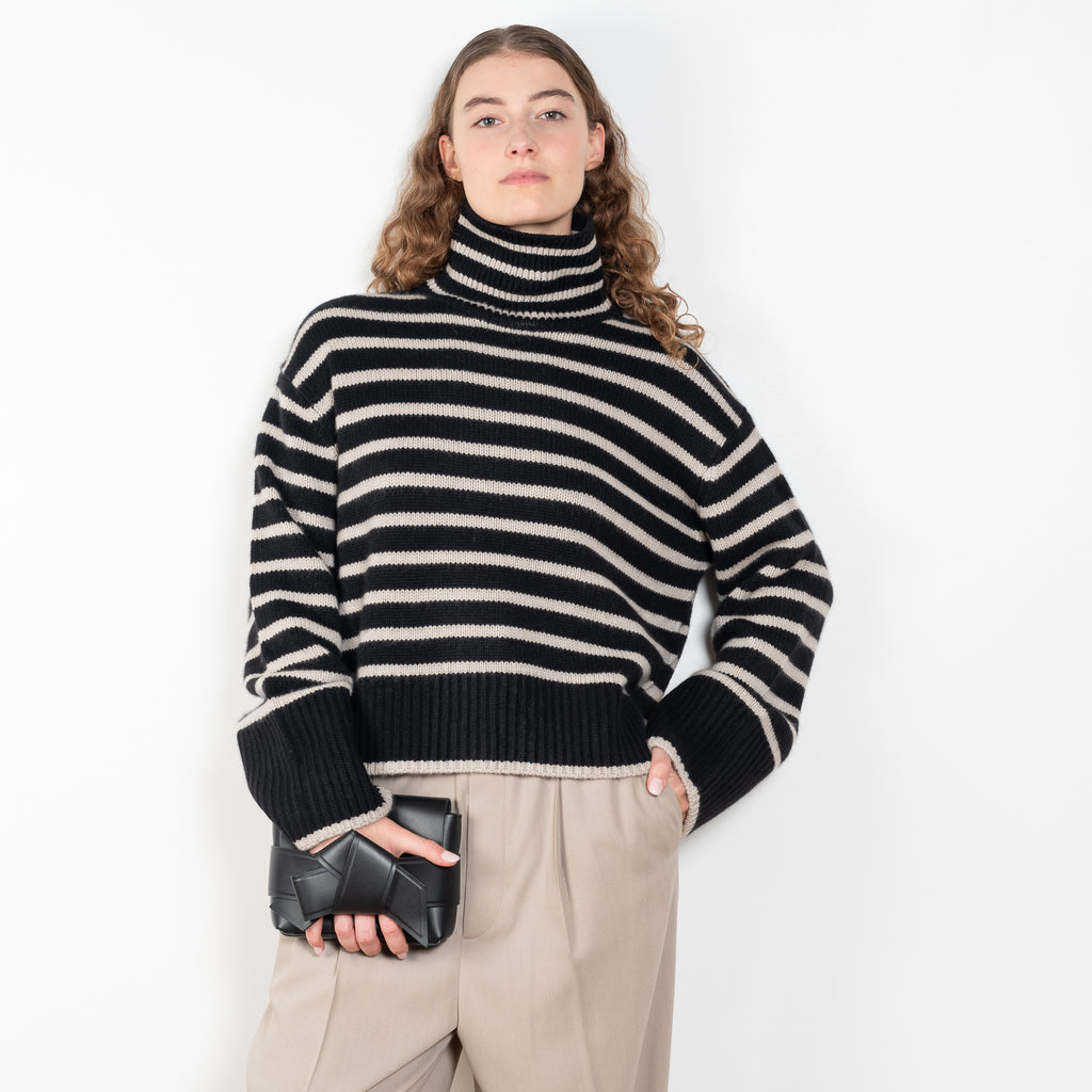 The Fleur Sweater by Lisa Yang has a relaxed silhouette with a loose high neck