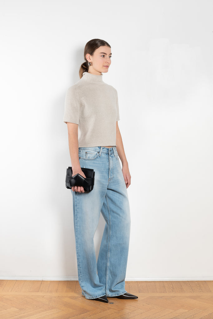 The Fride Sweater by LISA YANG has a standing mock-neck, with flattering, slim short sleeves and a cropped, regular fit.