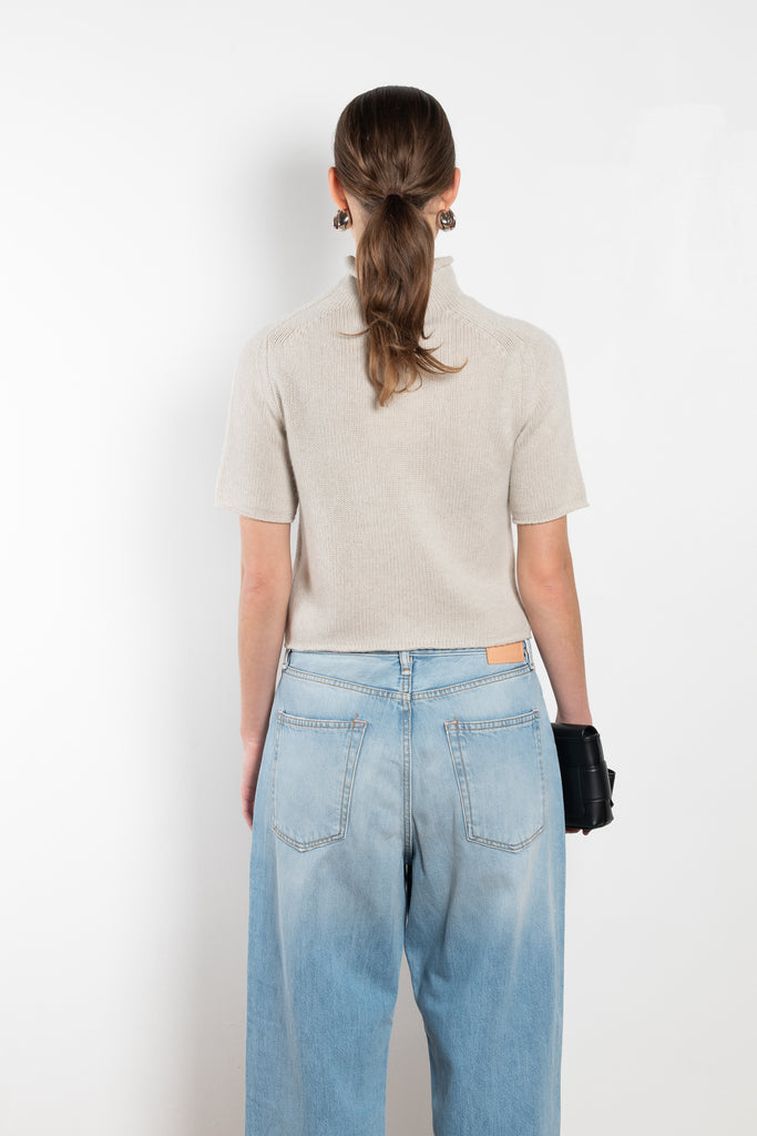 The Fride Sweater by LISA YANG has a standing mock-neck, with flattering, slim short sleeves and a cropped, regular fit.