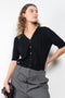 The Idun Cardigan by Lisa Yang is a 7 gauge, paddington-rib cashmere cardigan top with short sleeves