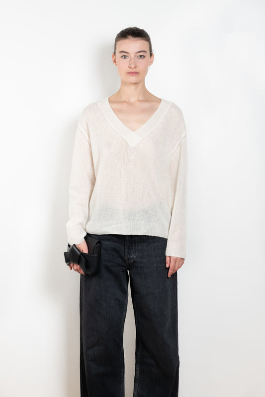 The Leona Sweater by Lisa Yang is a V-neck sweater with dropped shoulders in a textured cashmere silk 