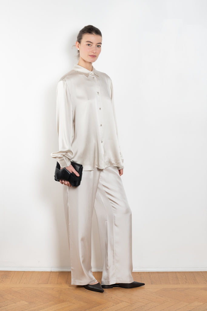 The Long Sleeve Shirt by LISA YANG in a woven satin silk, has a neat collar, dropped shoulders, and a relaxed fit