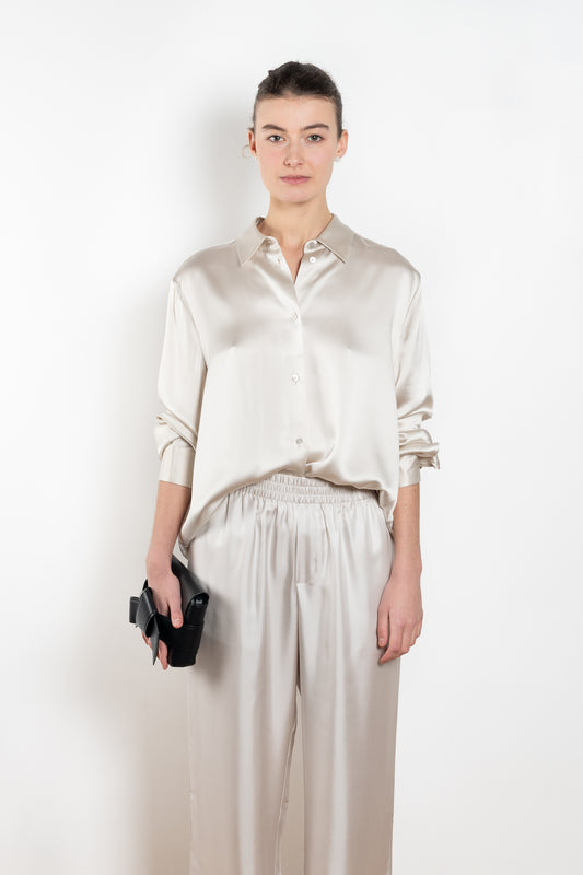 The Long Sleeve Shirt by LISA YANG in a woven satin silk, has a neat collar, dropped shoulders, and a relaxed fit