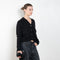 The Marionette Cardigan by Lisa Yang is a V-neck cardigan with a boxy fit in a soft textured cashmere silk blend