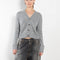 The Marionette Cardigan by Lisa Yang is a V-neck cardigan with a boxy fit in a soft textured cashmere silk blend