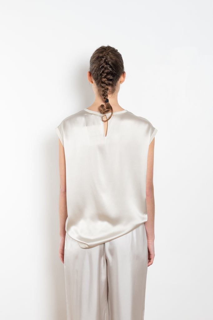 The Round Neck Sleeveless Top by LISA YANG in a woven satin silk, has a neat rounded neckline and relaxed fit silhouette