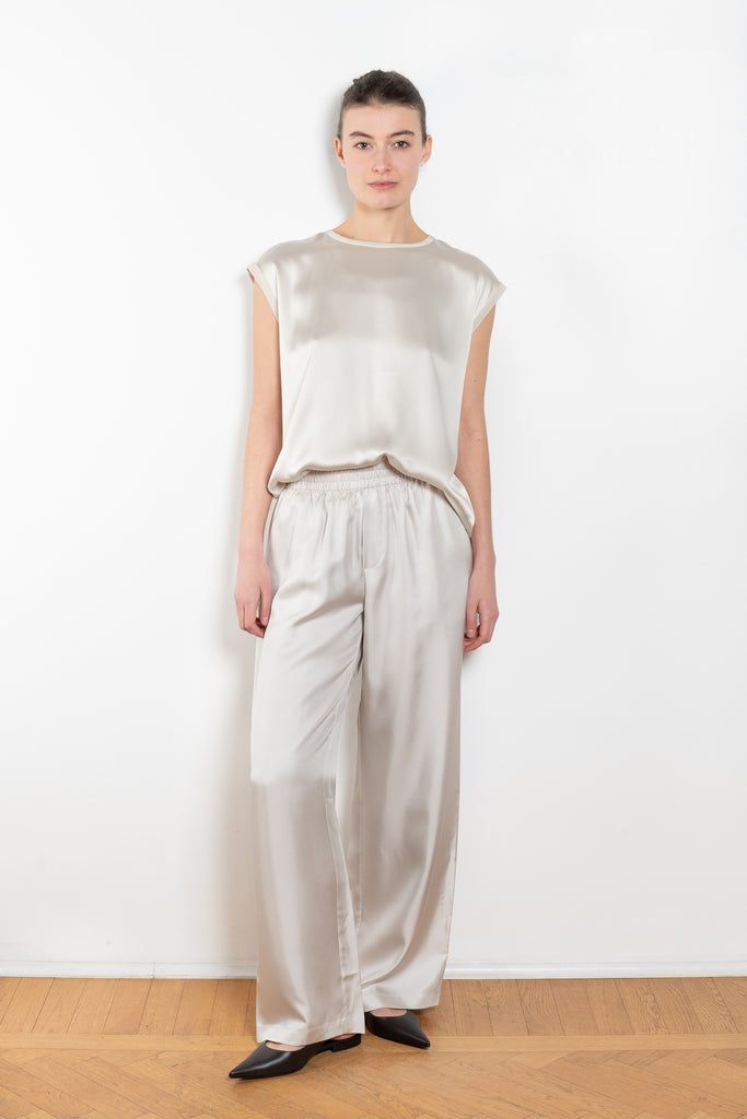 The Round Neck Sleeveless Top by LISA YANG in a woven satin silk, has a neat rounded neckline and relaxed fit silhouette