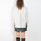 The Therese Sweater by Lisa Yang has a relaxed silhouette with a loose high neck