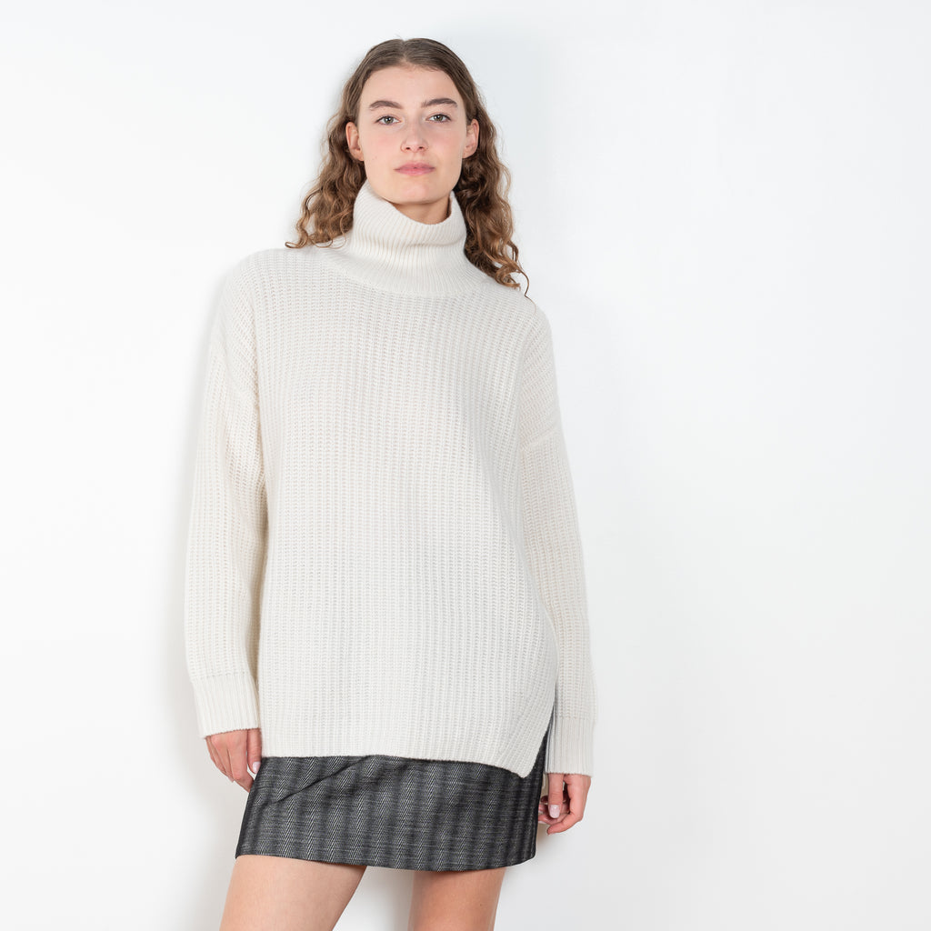 The Therese Sweater by Lisa Yang has a relaxed silhouette with a loose high neck