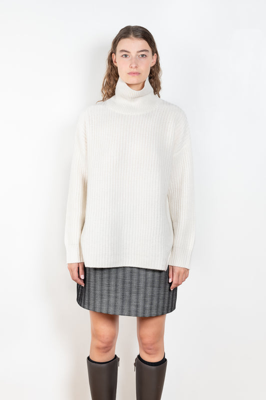 The Therese Sweater by Lisa Yang has a relaxed silhouette with a loose high neck