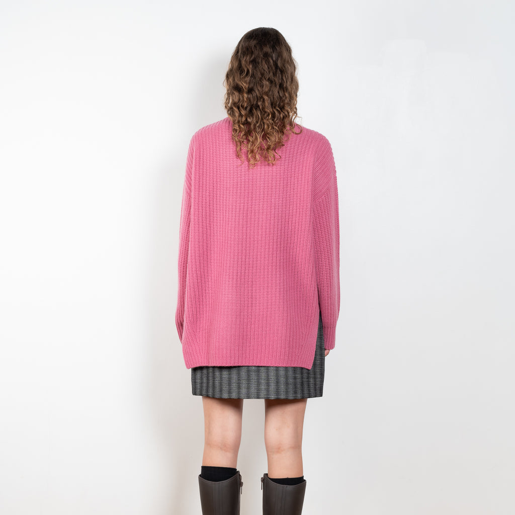 The Therese Sweater by Lisa Yang has a relaxed silhouette with a loose high neck