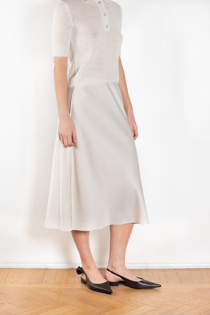 The Midi Skirt by LISA YANG in a double georgette woven silk, has a midi-length, slightly flared silhouette with an elasticated pull-on waistband