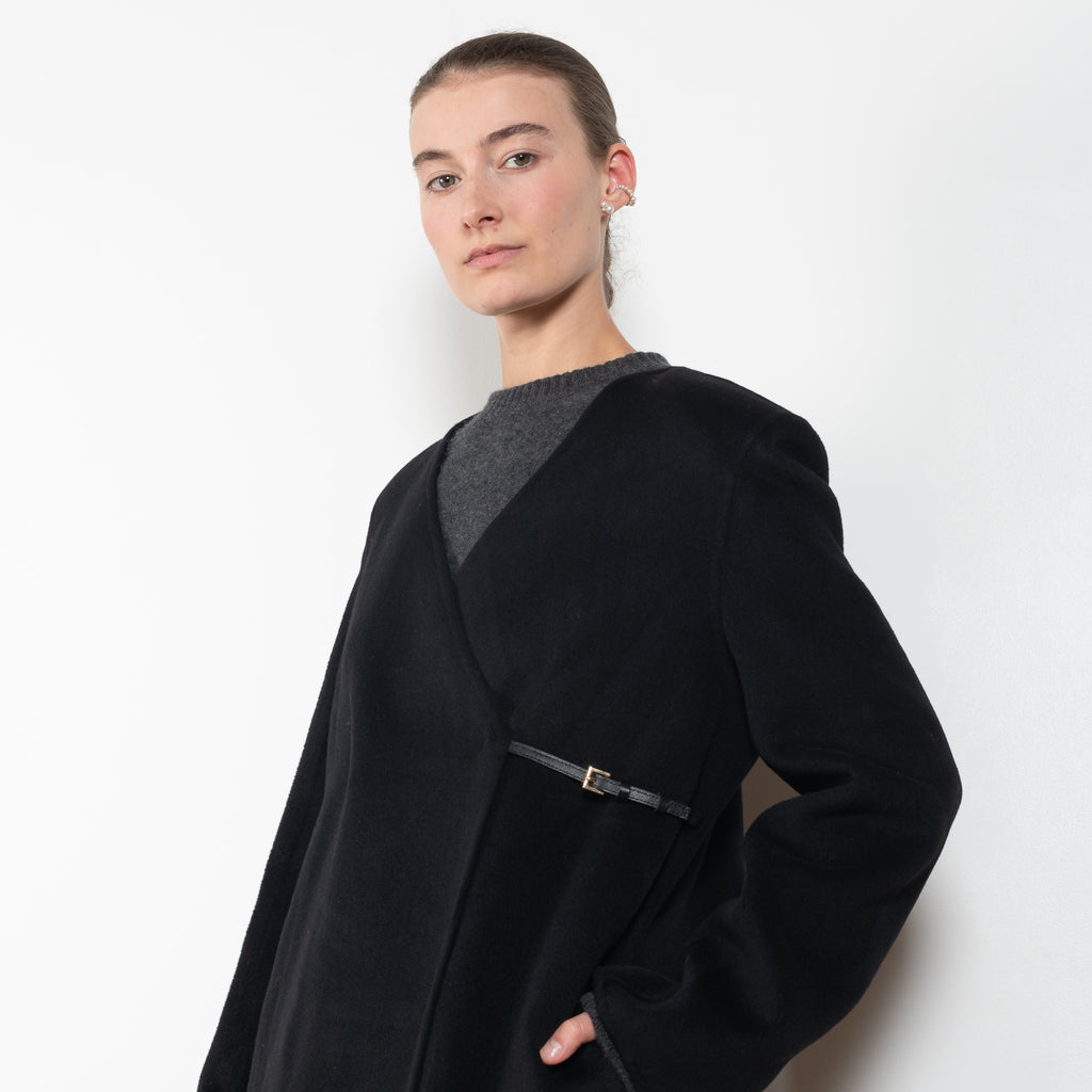 The Banie Coat by Loulou Studio is a straight coat with minimal lines and detailed with a fine leather strap