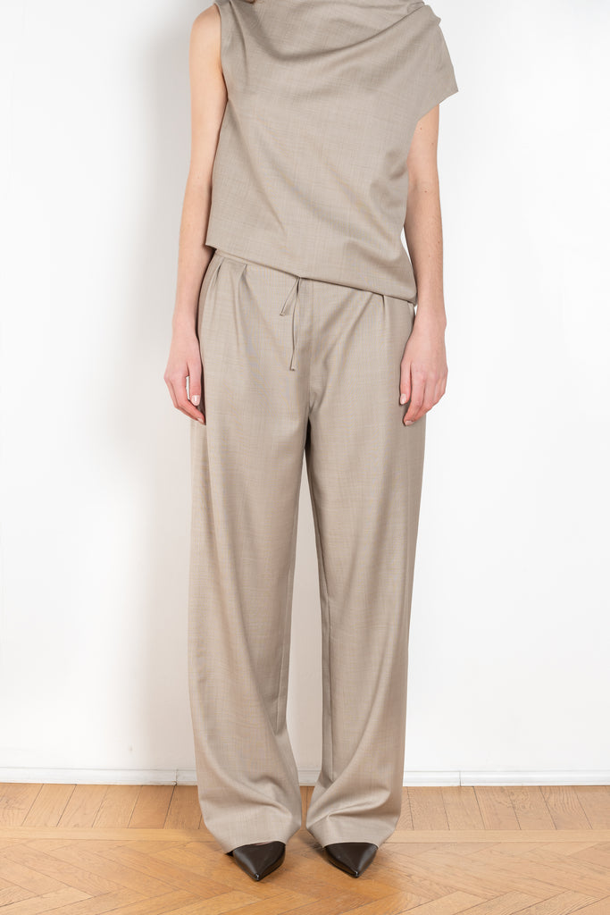 The Cove Trouser by Loulou Studio are relaxed suiting paints in a soft virgin chambray wool that sit on the waist, with a straight ample fit and a drawstring closure