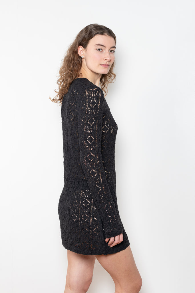 The Evan Dress by Loulou Studio is a lace stitch dress with a fitted silhouette, long sleeves and an open button hole neckline