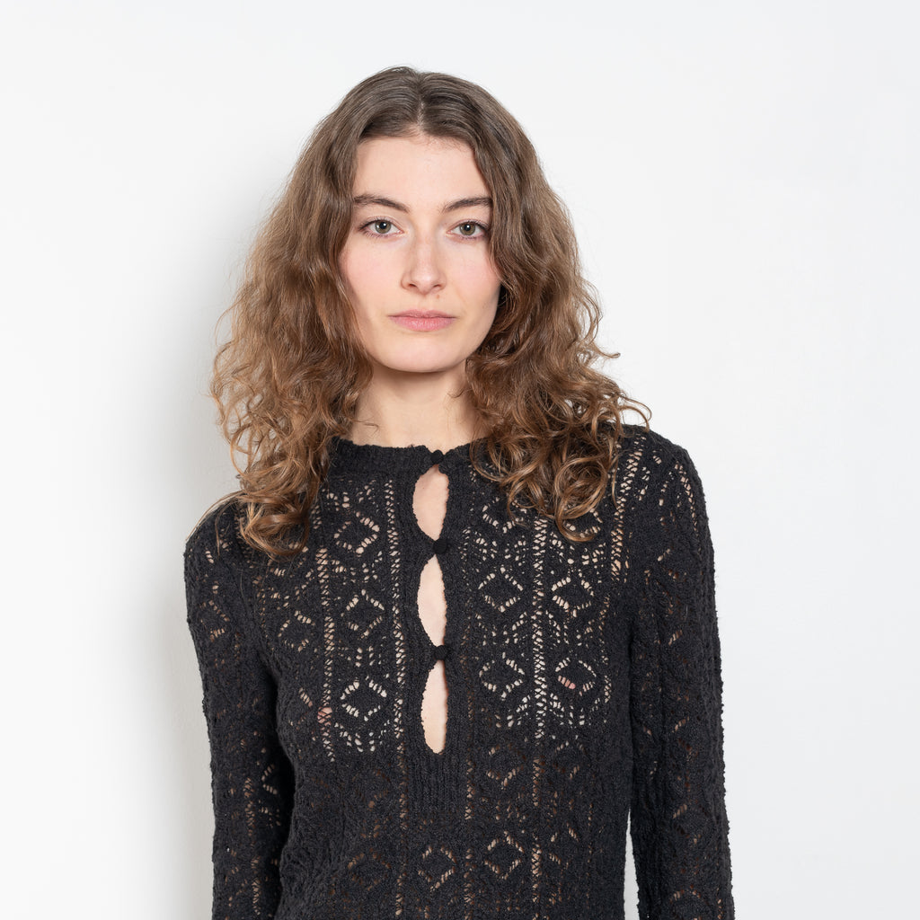 The Evan Dress by Loulou Studio is a lace stitch dress with a fitted silhouette, long sleeves and an open button hole neckline