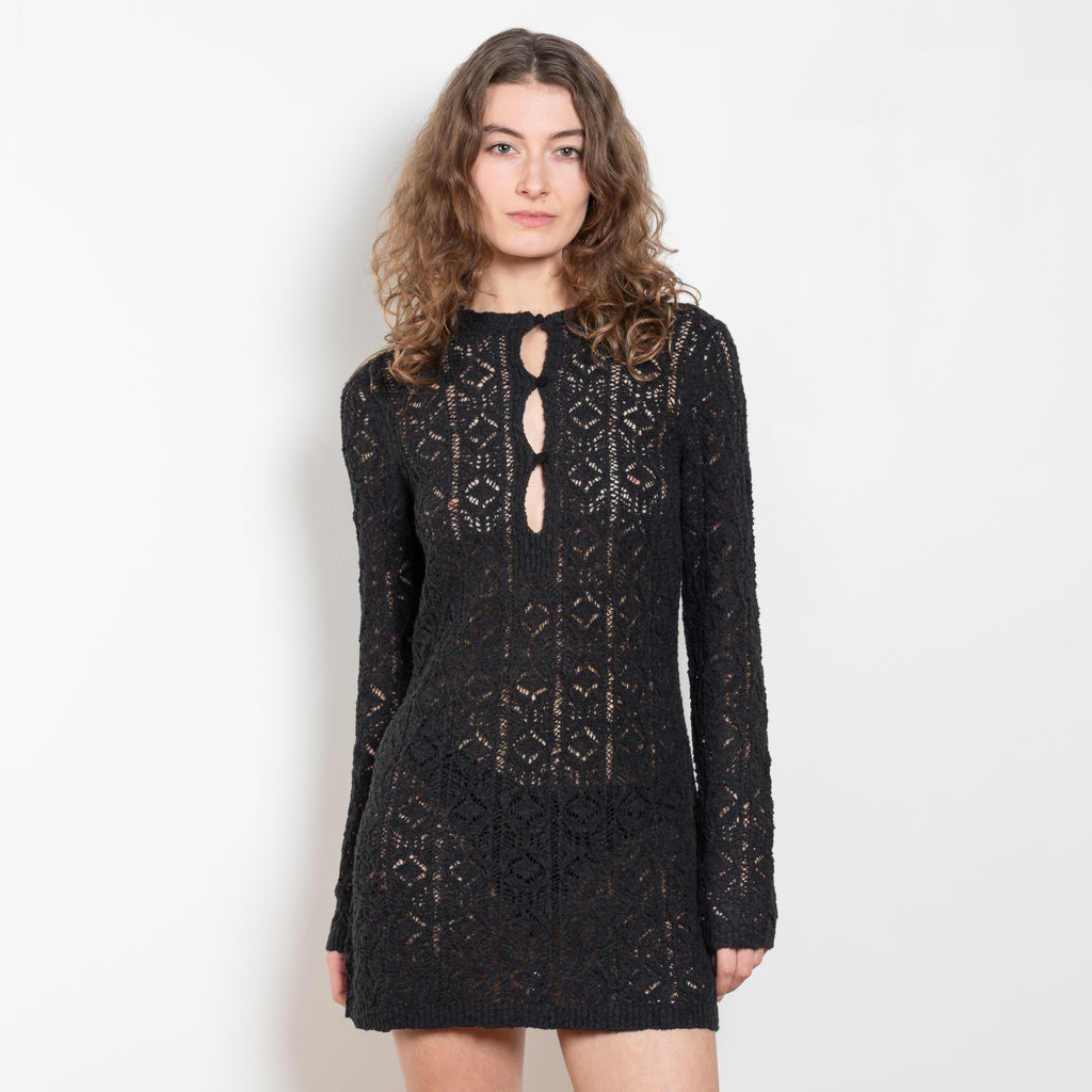 The Evan Dress by Loulou Studio is a lace stitch dress with a fitted silhouette, long sleeves and an open button hole neckline