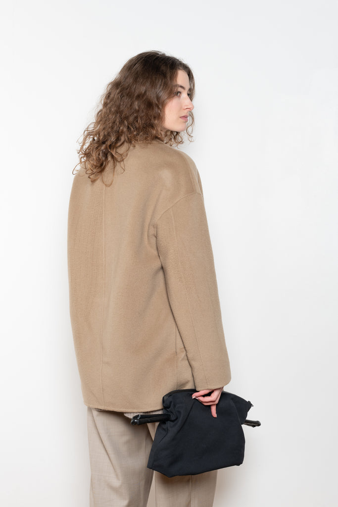 The Gio Coat by Loulou Studio&nbsp;is a round neck straight coat with minimal lines and an invisible closure