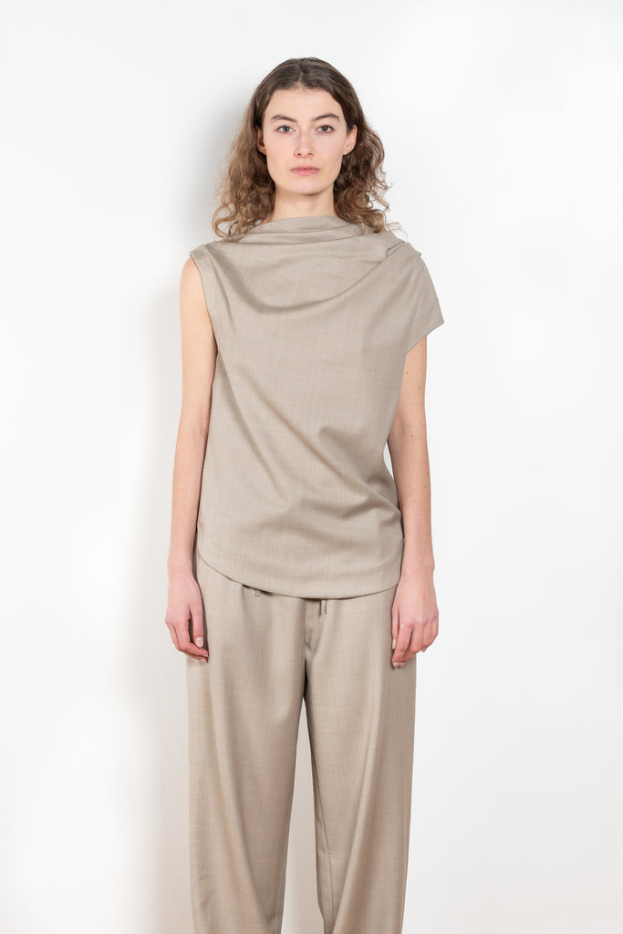 The Lyra Top by Loulou Studio is a sleeveless top with draped details in a lightweight virgin wool