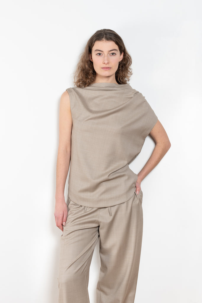 The Lyra Top by Loulou Studio is a sleeveless top with draped details in a lightweight virgin wool