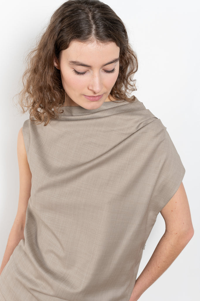 The Lyra Top by Loulou Studio is a sleeveless top with draped details in a lightweight virgin wool