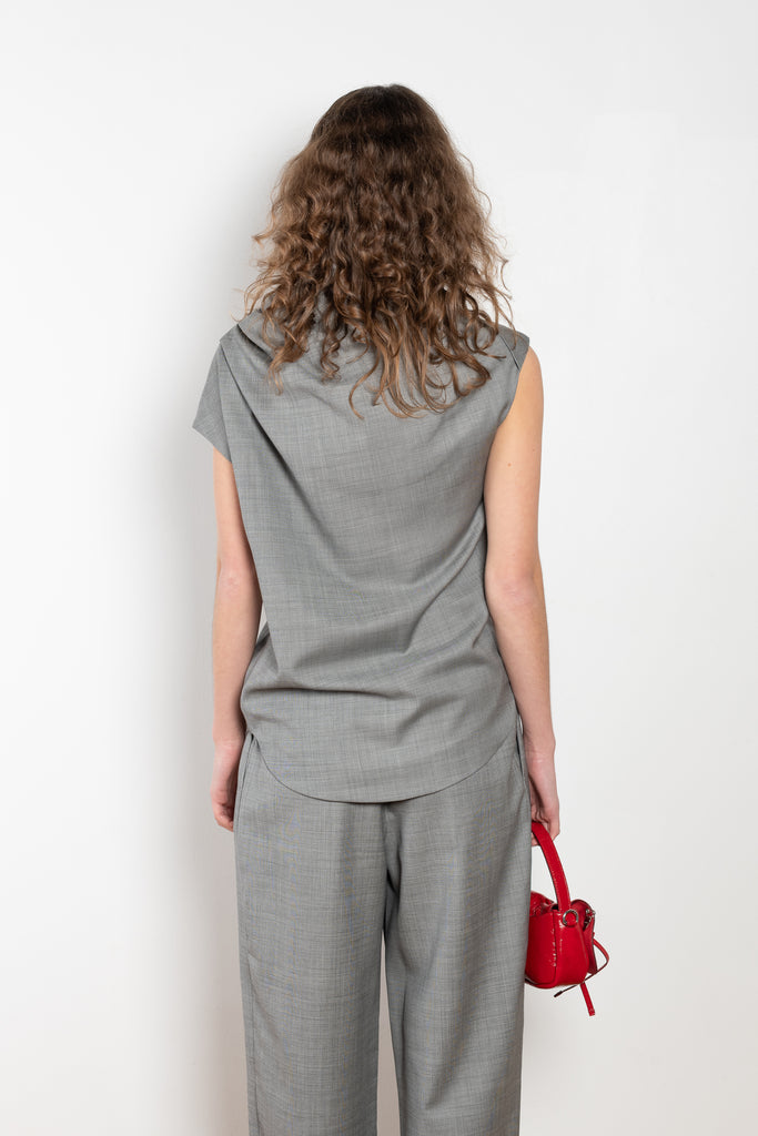 The Lyra Top by Loulou Studio is a sleeveless top with draped details in a lightweight virgin wool