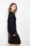 The Sage Sweater by Loulou Studio is an oversized sweater with an ample fit, a deep V, dropped shoulders and ribbed details